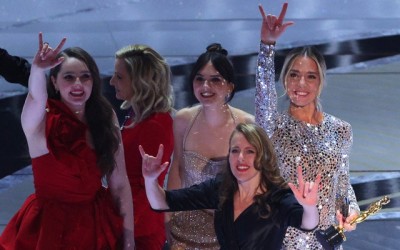 Onstage slap rattles Oscars, before ‘CODA’ triumphs