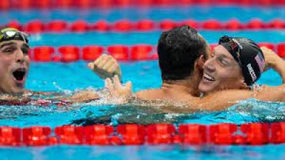 Olympic swimming ends with splashy new records, US gold