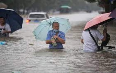 Flooding in central China turns streets into rivers, kills 12